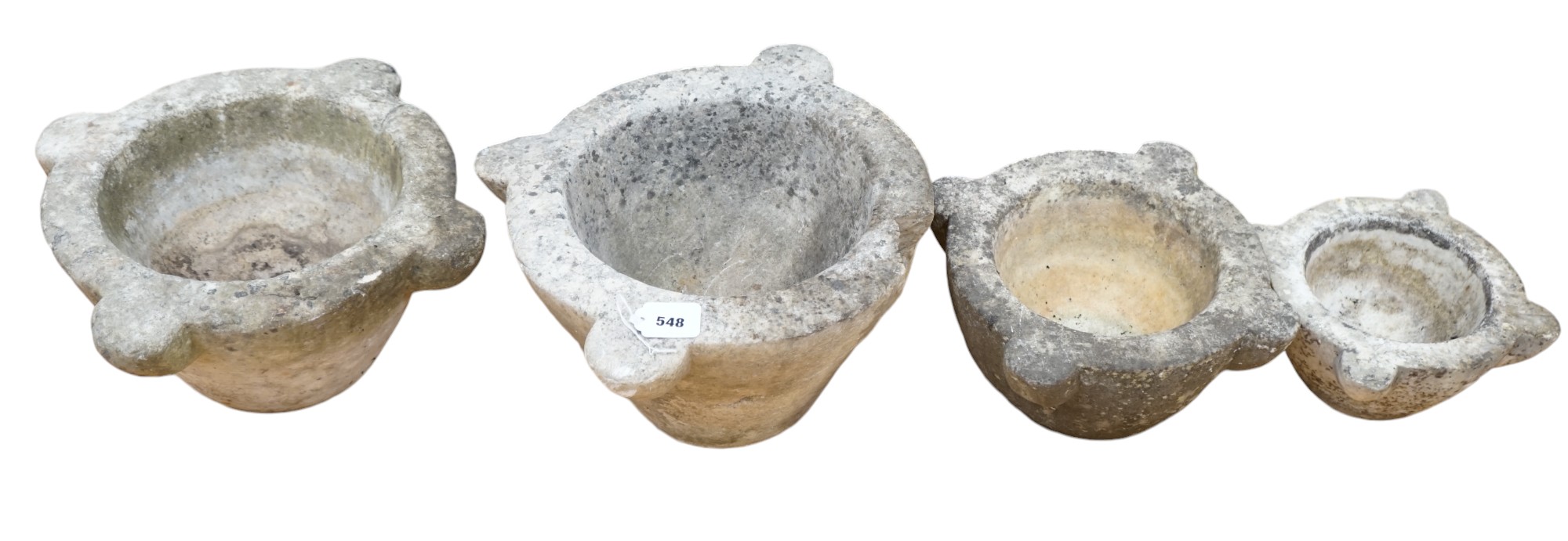 Four graduated marble mortars, largest 46.5cm wide across top rim. Condition - largest mortar has a handle missing, all have been stored outside and are marked